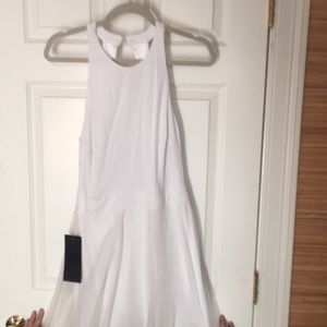 Bebe White summer dress with open cut out back.